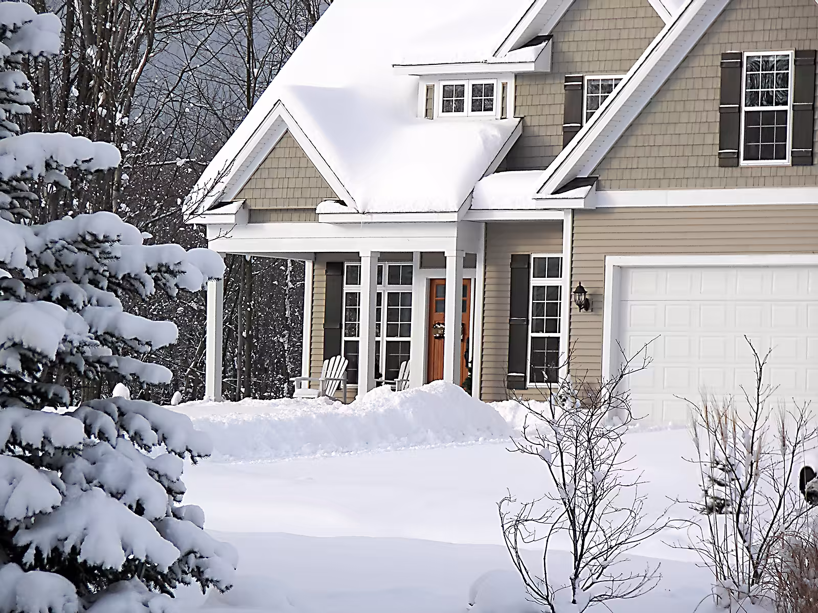 Modern new home covered in fresh winter snow.